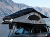 SMRT softshell rooftop tent, open black rainfly